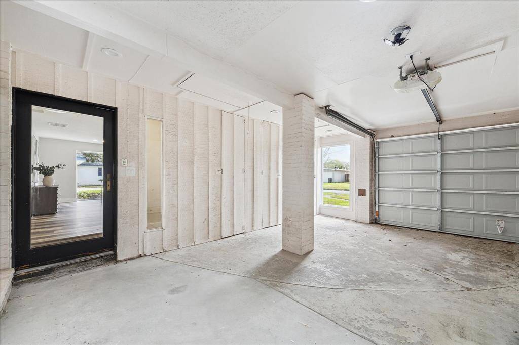 The oversized garage offers ample space for a workbench, tools, and more with a remote garage door opener for added convenience.