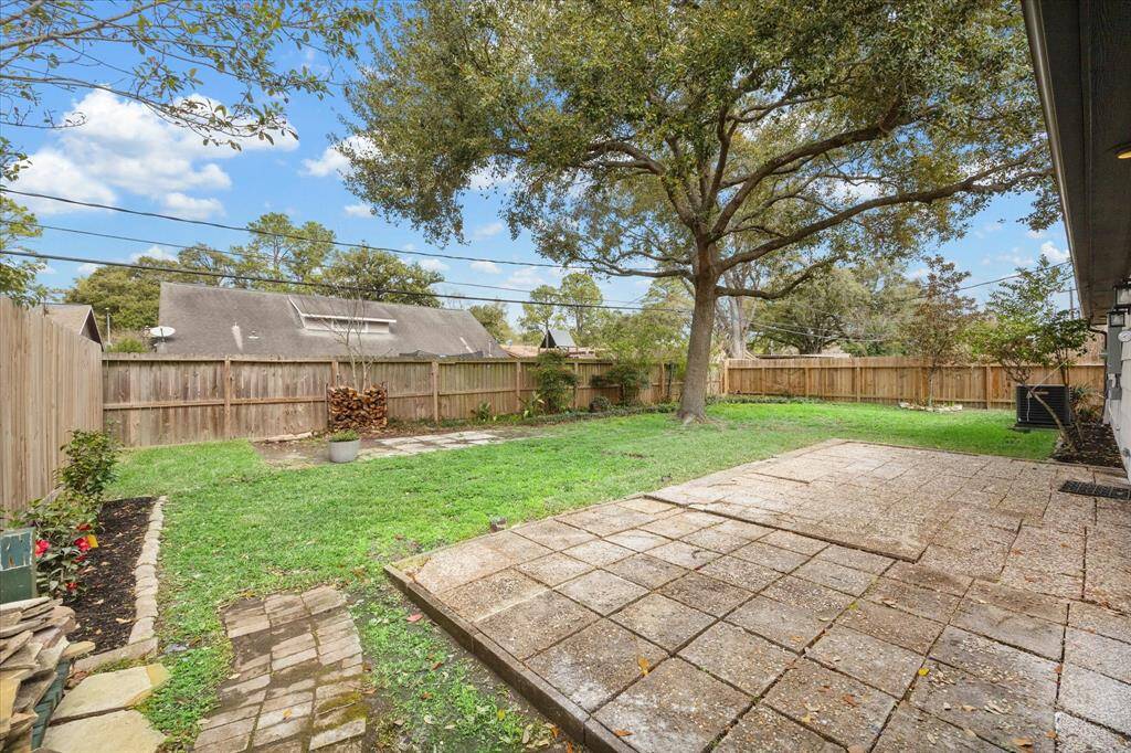 This expansive private backyard patio offers the perfect setting to savor your morning coffee or unwind and enjoy a nightcap with your favorite person.