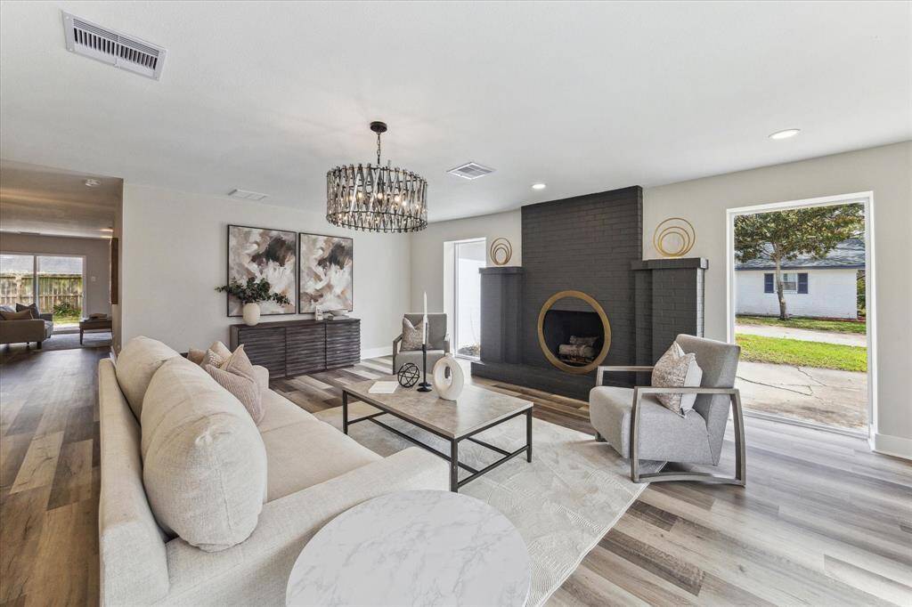 Floor-to-ceiling windows bathe this space in abundant natural light, enhancing the bright and airy atmosphere while offering stunning outdoor views creating a seamless connection between indoor comfort and outdoor beauty.