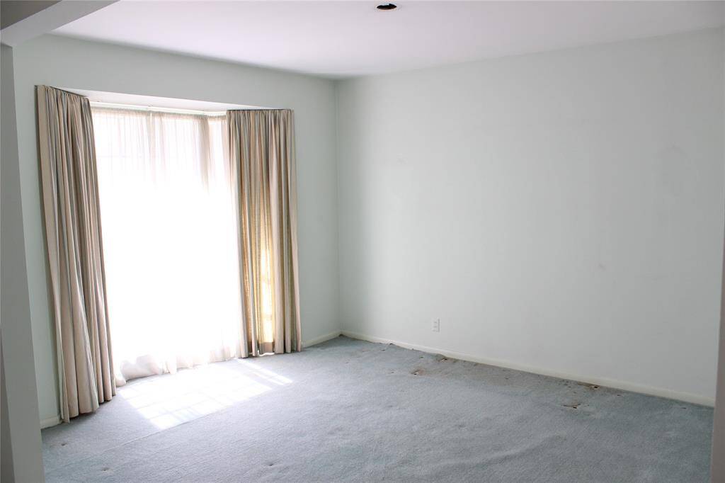 Dining room has plenty of space for your table and chairs.  The bay windows give a feeling of extra space.