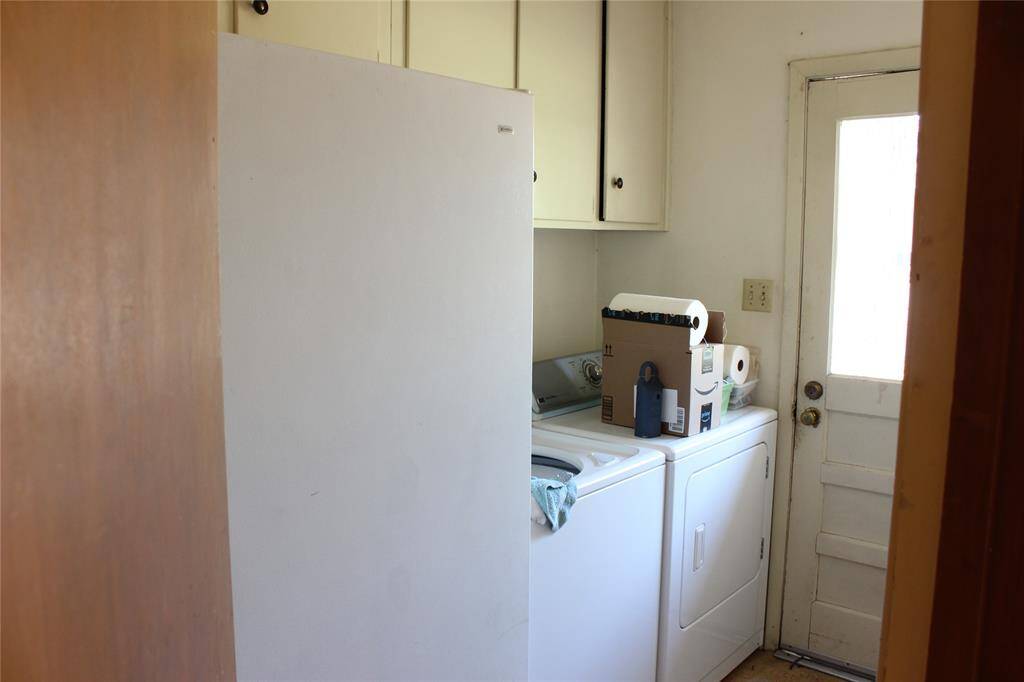 Large laundry room with plenty of space and leads to the outside and garage