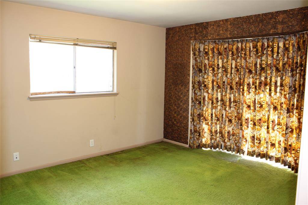 Secondary bedroom in front has a bay window for additional light.
