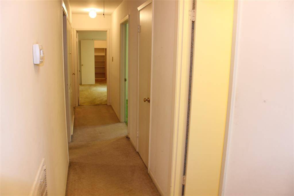 Hallway to connects all the bedrooms on one side of the house