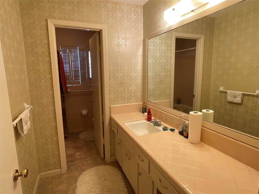 Guest bathroom is convenient to the secondary bedrooms and family room
