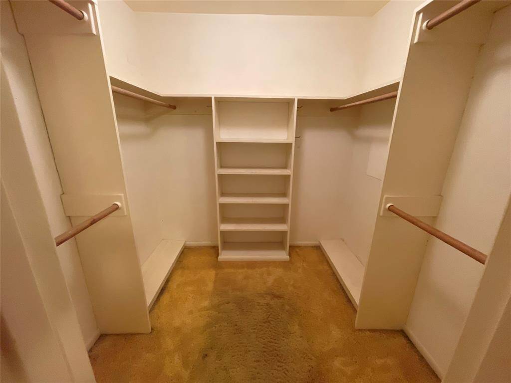 Primary closet is a good size for this age home.