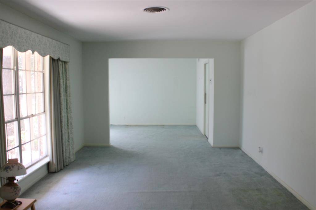 Guests are greeted with a formal living room off the front entrance and the dining room to the far end.