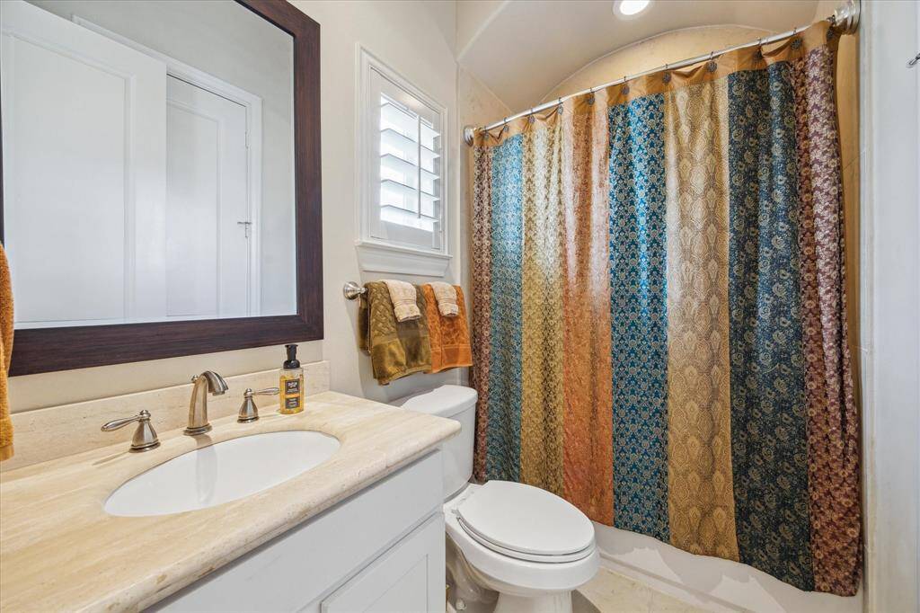 ...a private Bath with marble Vanity and a tub/shower combination.