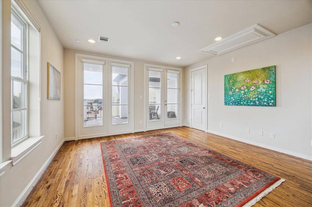 The Flex Room has hardwood floors, a walk-in Closet.  Through the French doors...