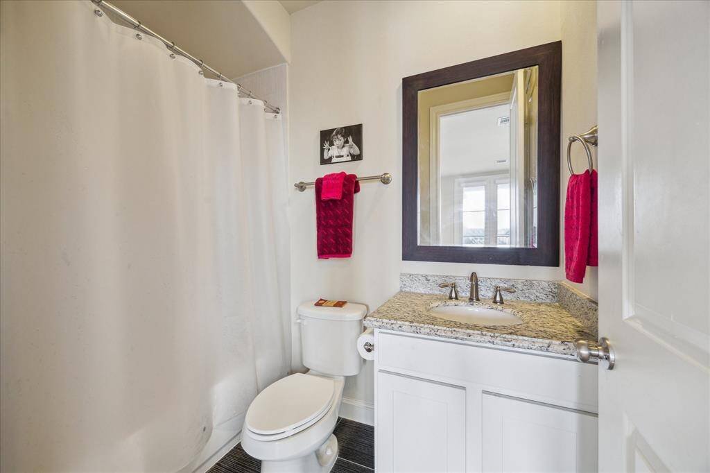Completing the Fourth floor is an ensuite Bath with custom Vanity topped with soothing shades found in the granite counter.