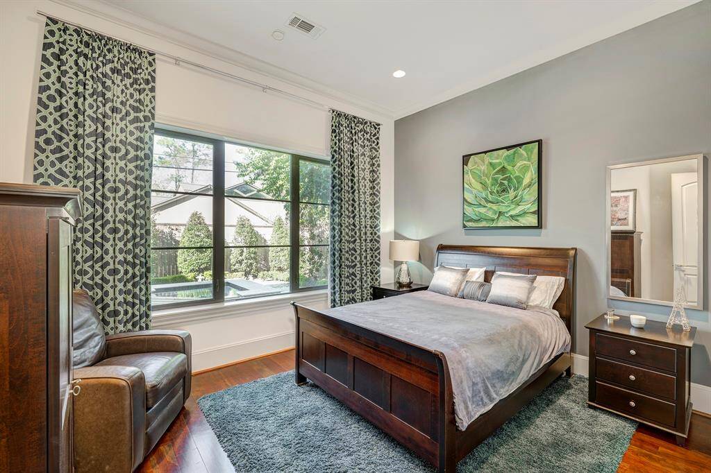 One bedroom down with a soothing view of the cascading spa fountains. Your guest might stay too long. Can be a study. Drapes stay throughout.