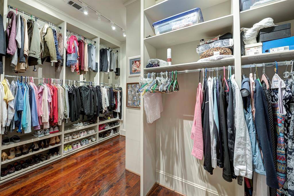 One of 2 closets! This one is extravagant with L Shape size and has a dresser. Both have dressers, shoe shelves and pull down rods for double rods.