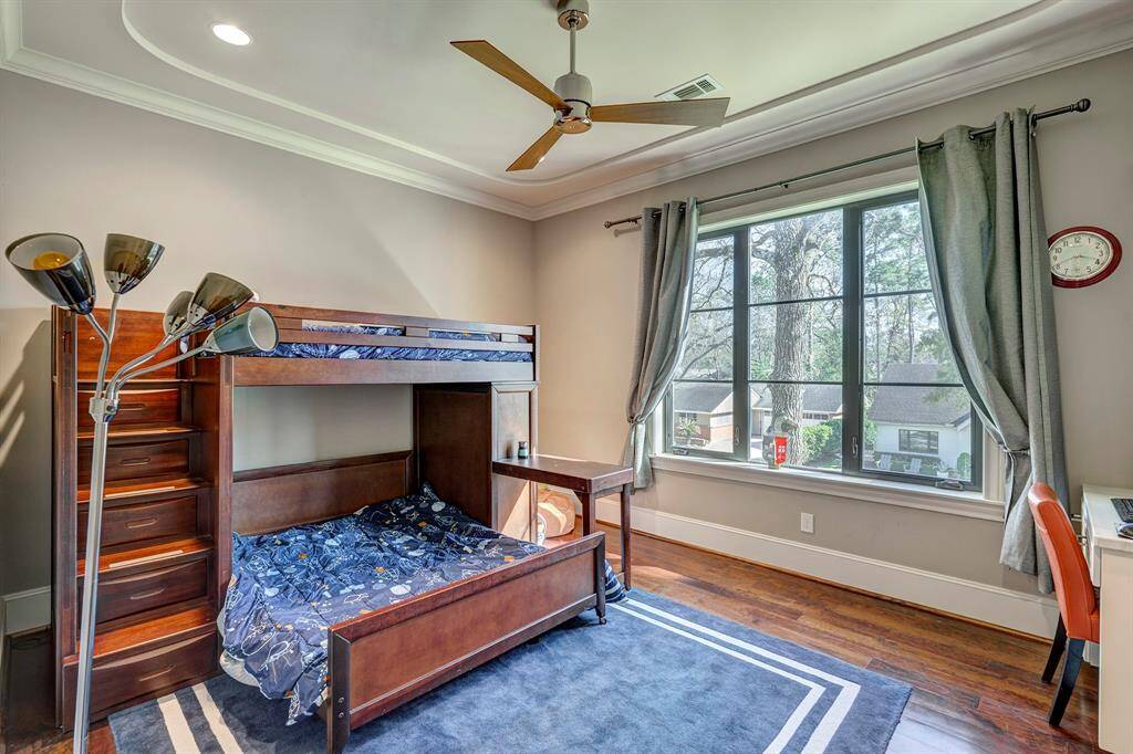 First bedroom upstairs has a built in desk and private bath w shower. Walk in closet. Drapes stay.