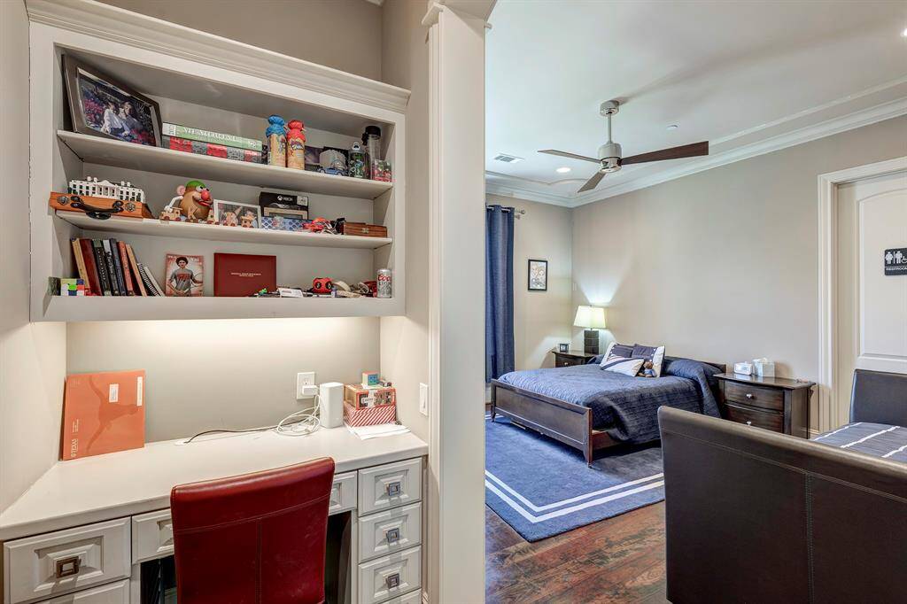 3rd bedroom up has private desk and bathroom entrance to bathroom that is open to a hall near game room
