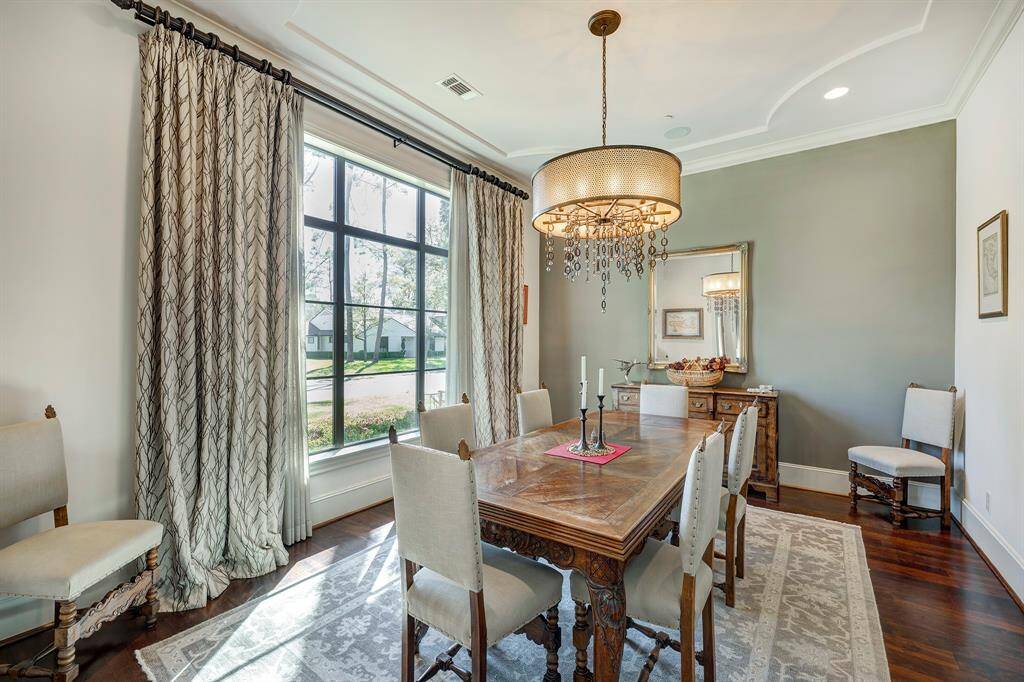 You can expand your table! Beautiful drapes and light fixtures throughout stay.