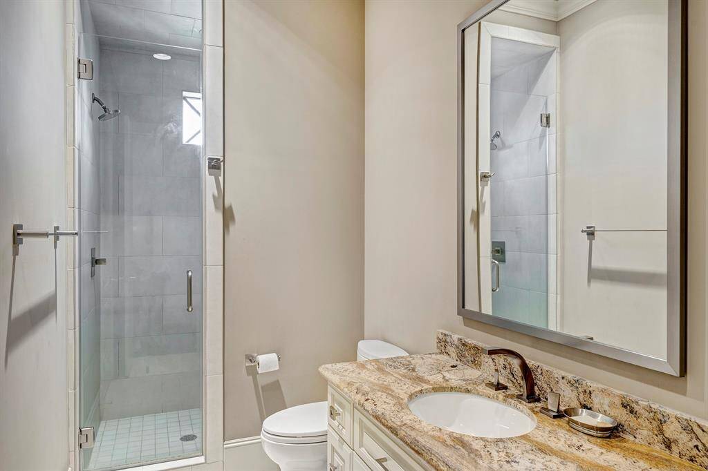 Bathroom for last bedroom and access for gameroom. Has laundry hamper.