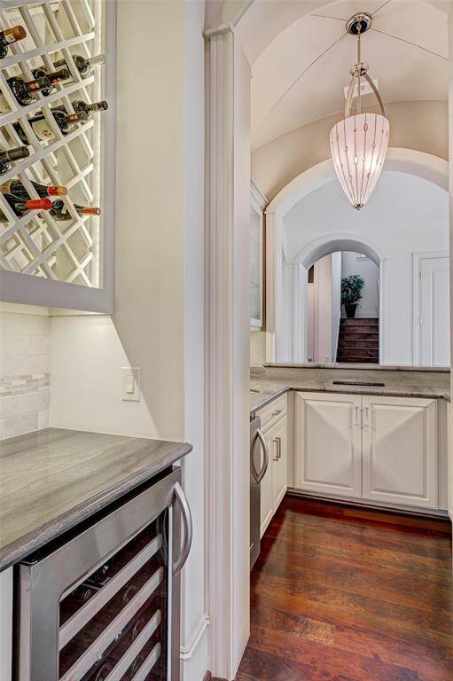 Wet bar beverage refrigerator and ice maker! Wine bottle rack is above the beverage refrigerator.