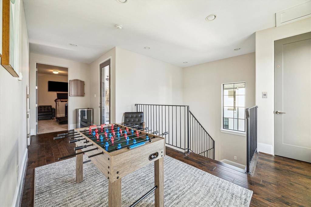 The third-floor landing provides a fun flex space perfect for games or a reading nook, complete with rich hardwood flooring and great natural light.