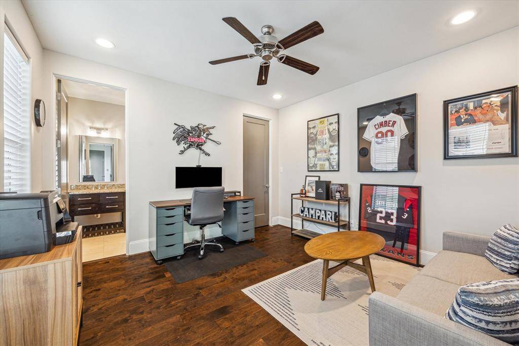 This upstairs bedroom is currently being used as a stylish home office and lounge, perfect for remote work or relaxing with your favorite memorabilia.