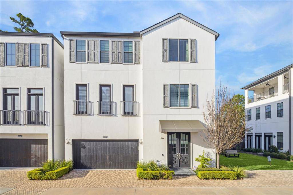 Corner unit offers added privacy and green space just steps from your front door. Beautiful architecture and manicured landscaping create a serene first impression.