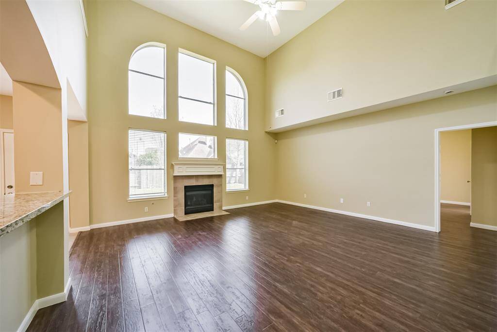 Gorgeous windows with a fireplace that extends out rather than up for more window light!