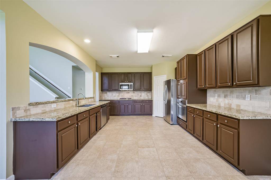 Big kitchen with lots of cabinet space.