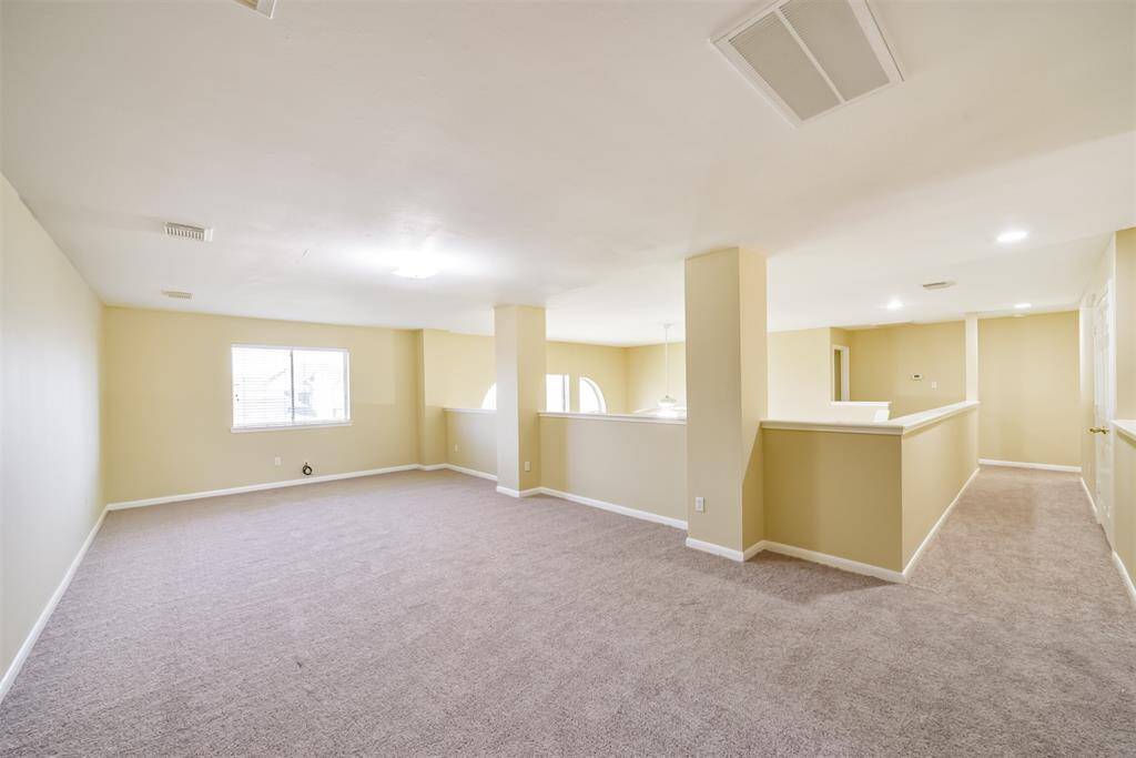 This spacious den offers a private retreat, separate from the bedrooms.