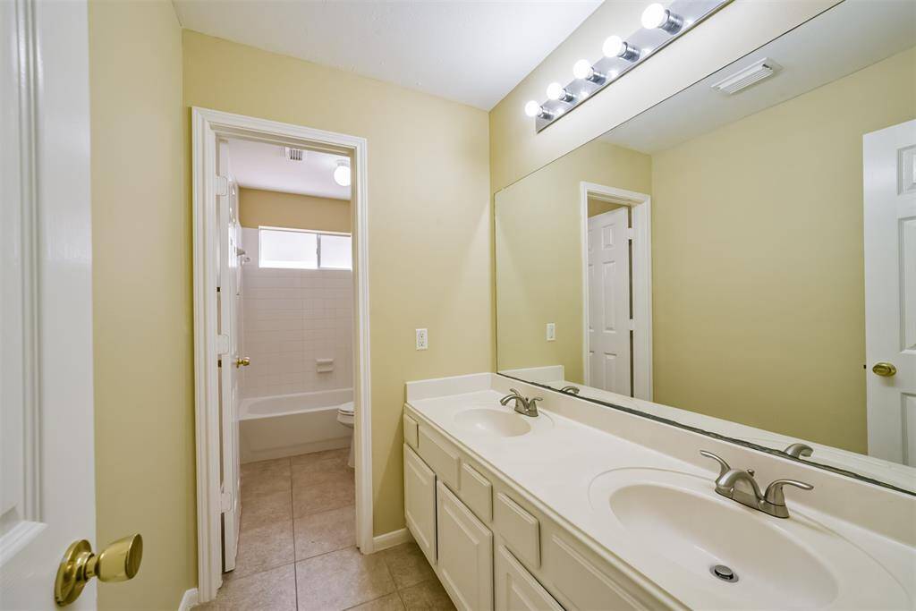 Secondary full bath with dual sinks – perfect for busy mornings with plenty of room for everyone!