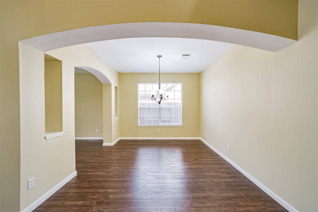 Formal dining room with beautiful arches.