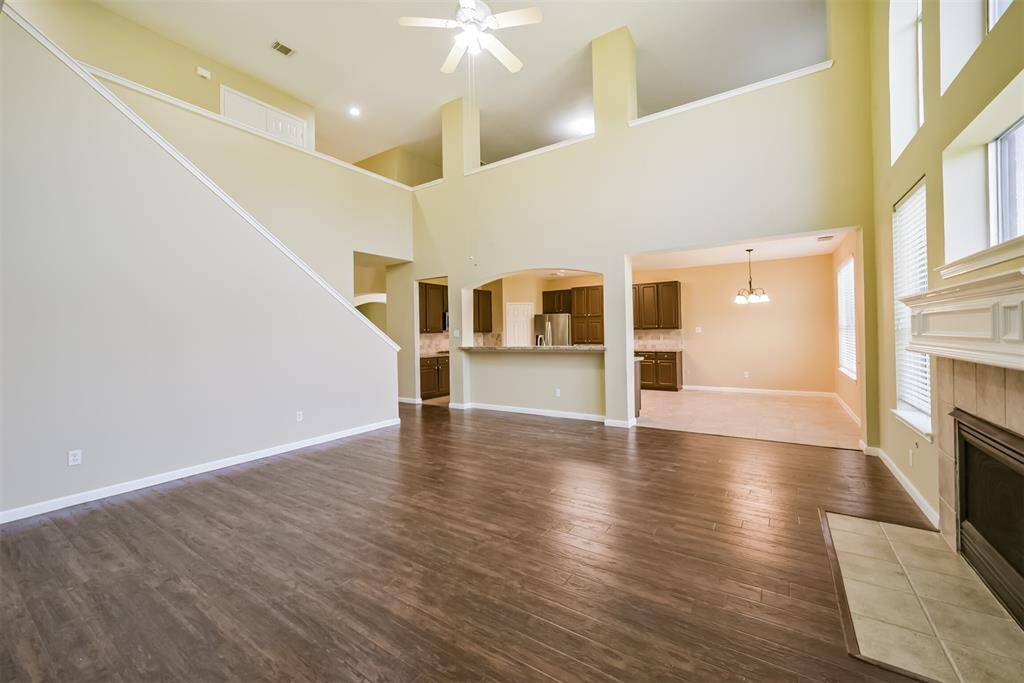 A spacious living room with beautiful architectural details and high ceilings that create a grand feel.