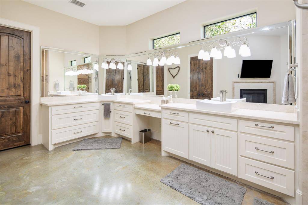 Step into the stunning en-suite primary bath. The ample counterspace, natural light & beautiful marble features standout in this space. Separate his and hers closets make organization easy!