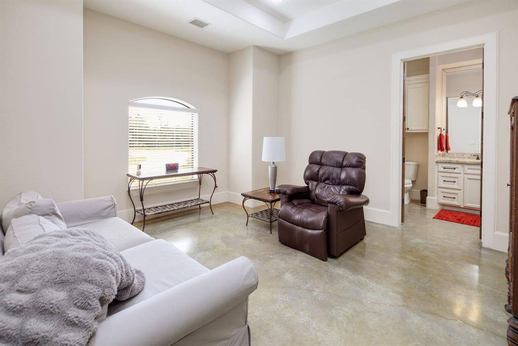 This bedroom has a beautiful tray ceiling & an en-suite bathroom with a huge walk-in shower! You can also find a sizeable walk-in closet.