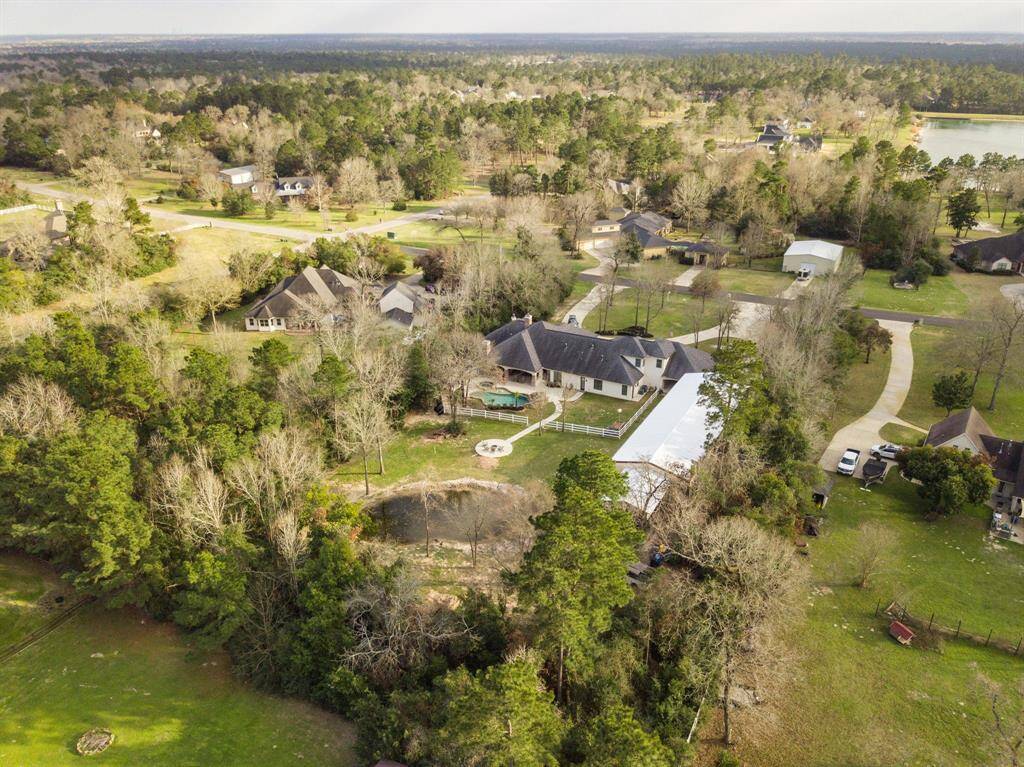 Located in Crown Oaks on a 2.09 acre lot that has been thoughtfully landscaped & maintains a privacy buffer of trees between each neighbor.