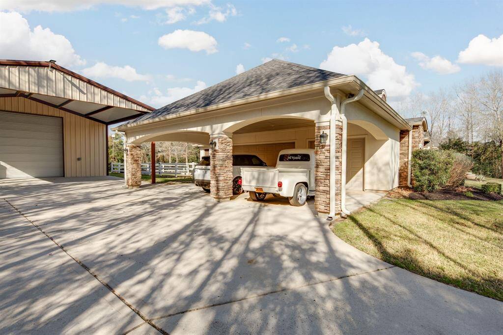 3 car garage with extended carport. Combining all the covered parking options for this property...you could easily park 10+ vehicles!
