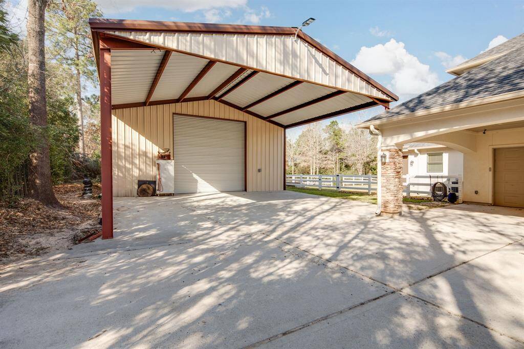 Huge 2,584 square-foot insulated metal shop with covered parking on the front and the back!