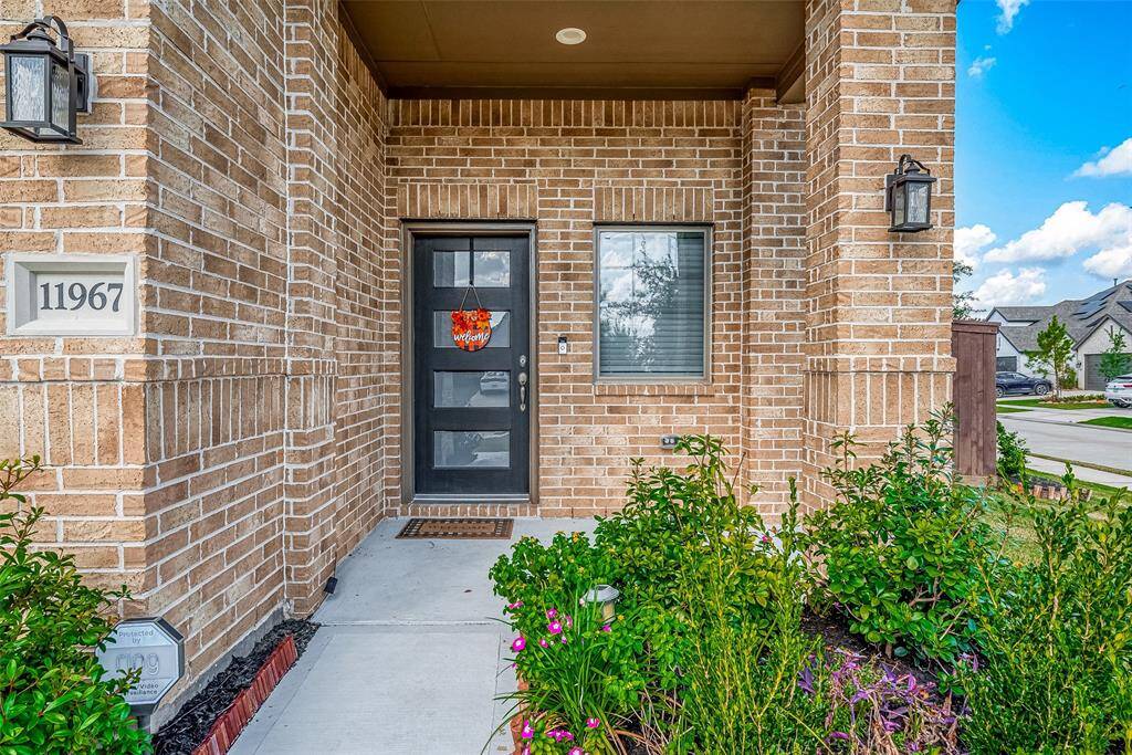 Discover your new home! This charming entryway invites you into a warm and welcoming space, perfectly nestled in a vibrant neighborhood.