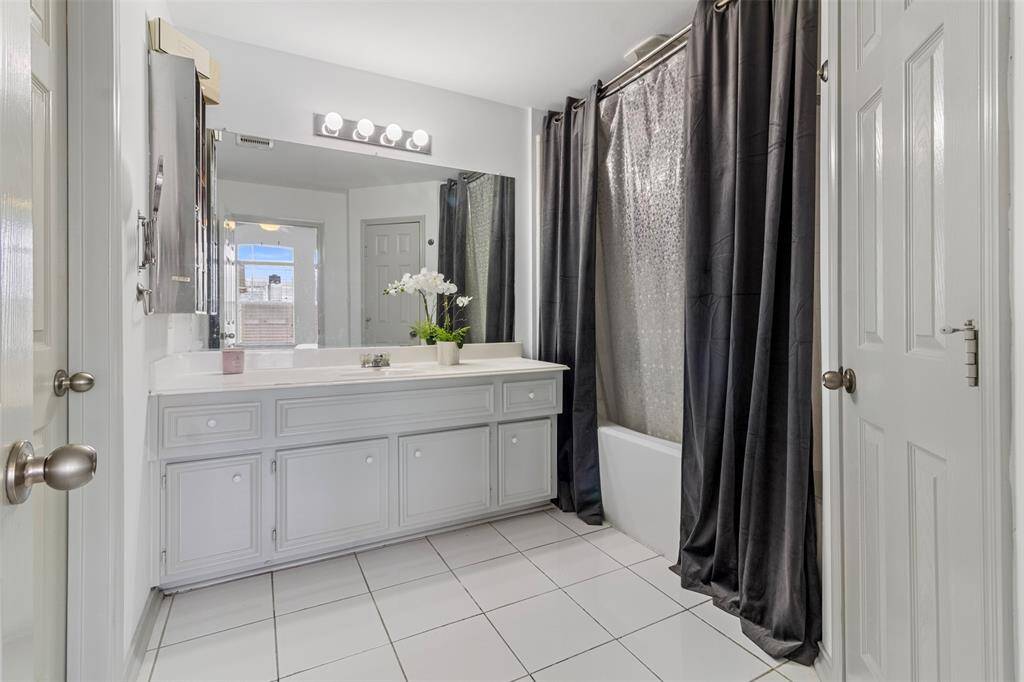 The en-suite bathroom adds another touch of luxury to the space.