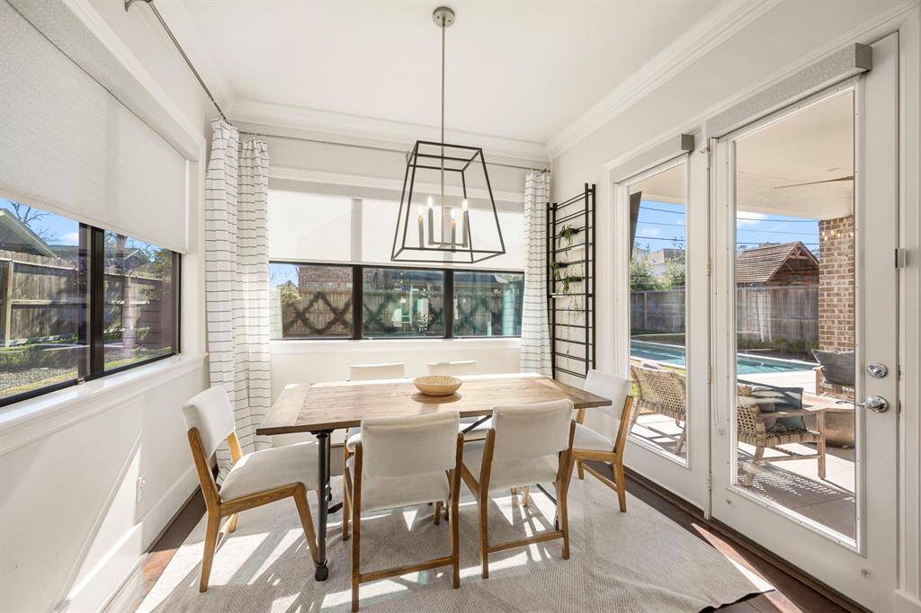 Enjoy meals in this beautiful dining room that opens to the outdoor covered patio.