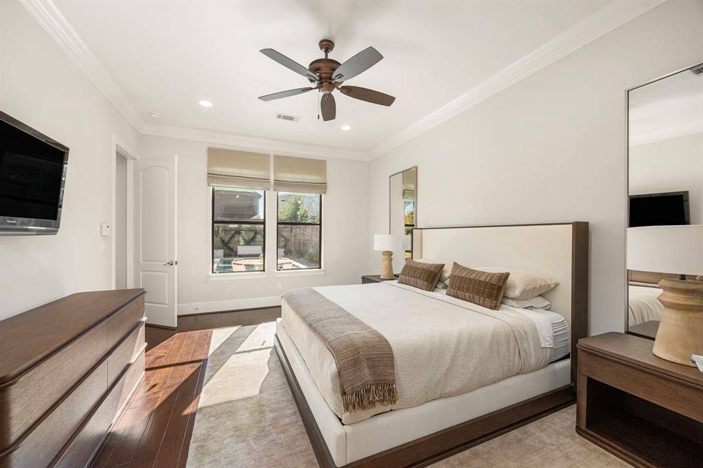 First floor primary bedroom with views of pool.