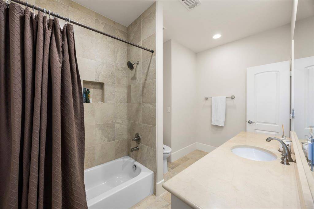 One of two full upstairs bathrooms. This one has an entrance to the hallway near gameroom, and is also connected to the guest bedroom.