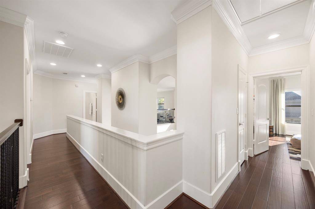 Upstairs hallway. Hardwoods throughout! No carpet.