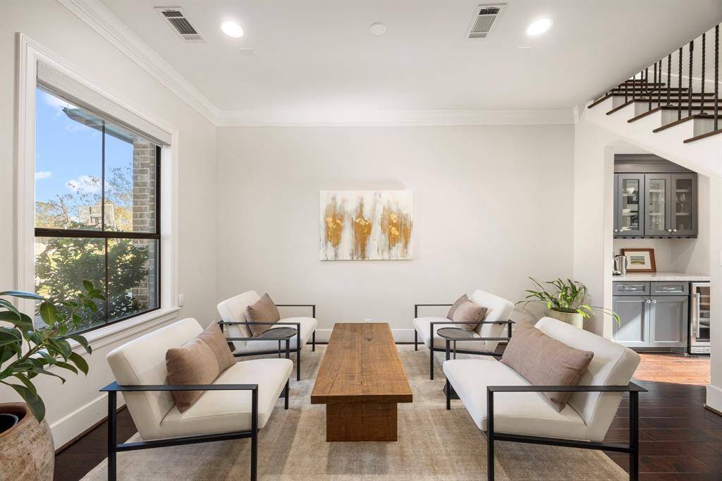 Currently being utilized as a lounge area, this space can also be a used as a formal dining room.