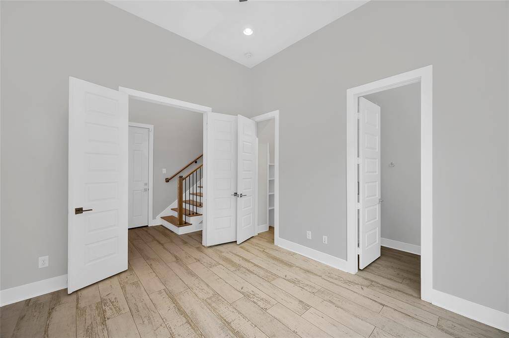 The first floor bedroom is perfect for use as a guest suite or office space.