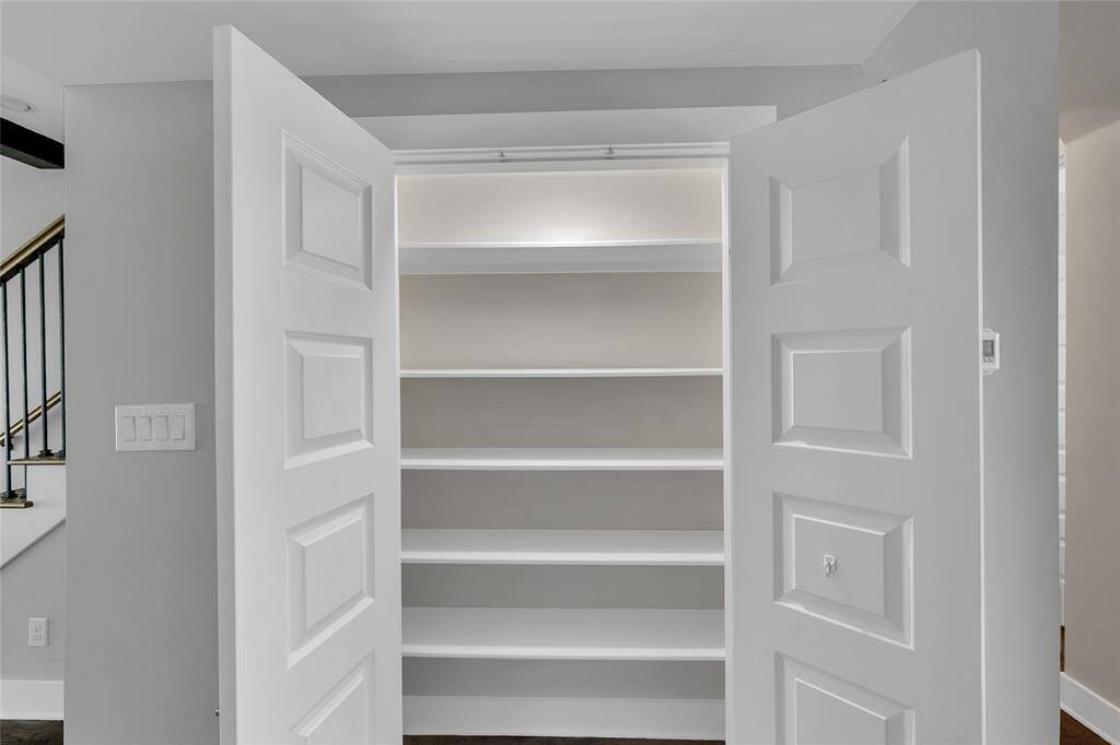 The kitchen includes a pantry with floor to ceiling shelving!