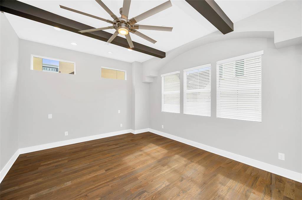 Neutral tones give the lofty primary suite a tranquil feel.