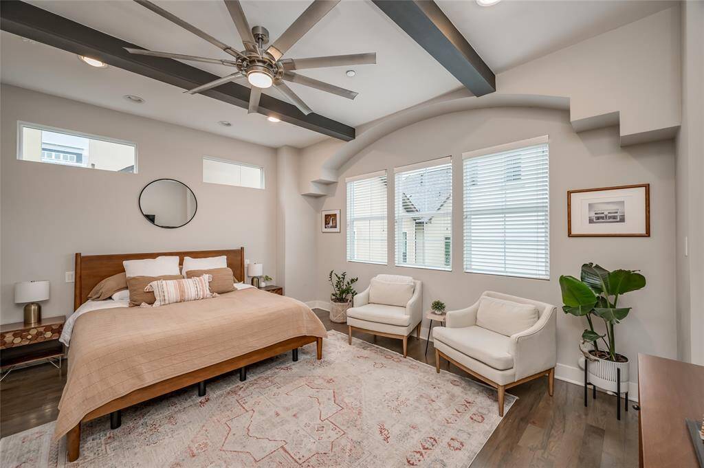 Convenient bedside switches for overhead recessed lights, decorative arches and wood beams are a repeated theme throughout the house.