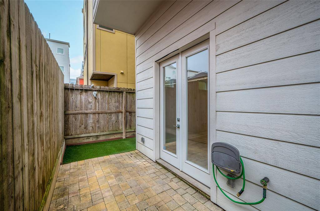 A turfed, fully fenced back yard with room to grill and chill.