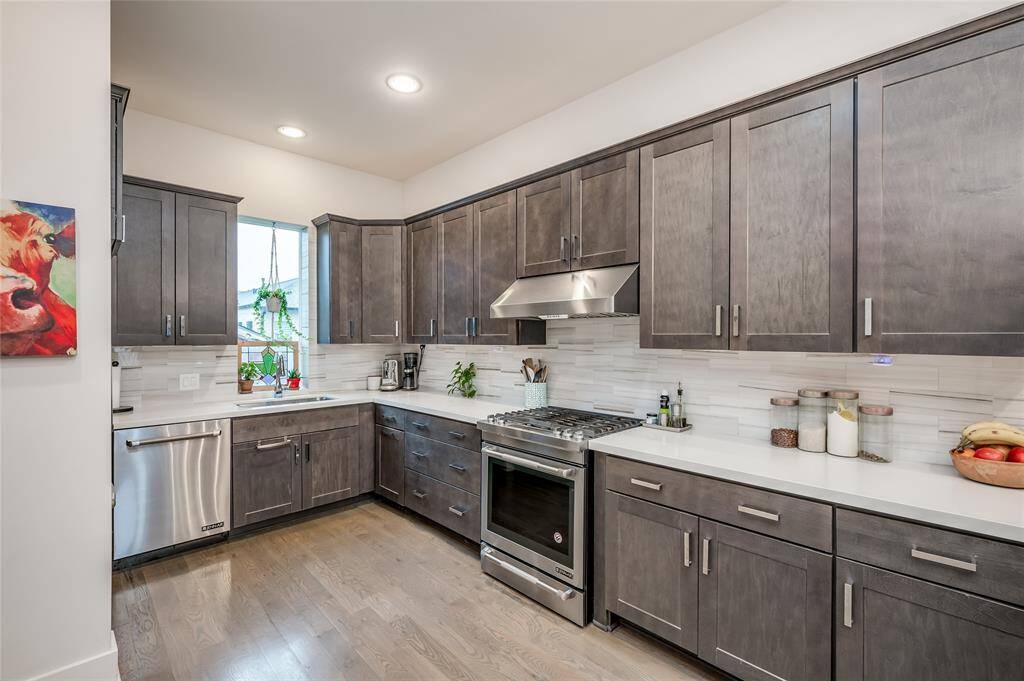 Stainless steel appliances and abundant work space in a stunning kitchen that opens to the rest of the living area.