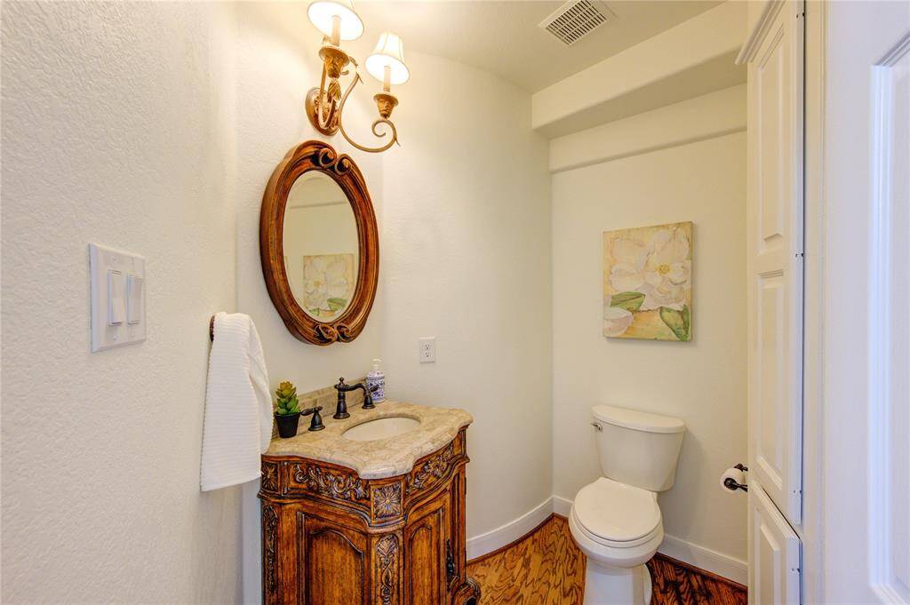 Thoughtfully designed with elegance and functionality in mind, this half-bath adds a touch of sophistication to the main level.