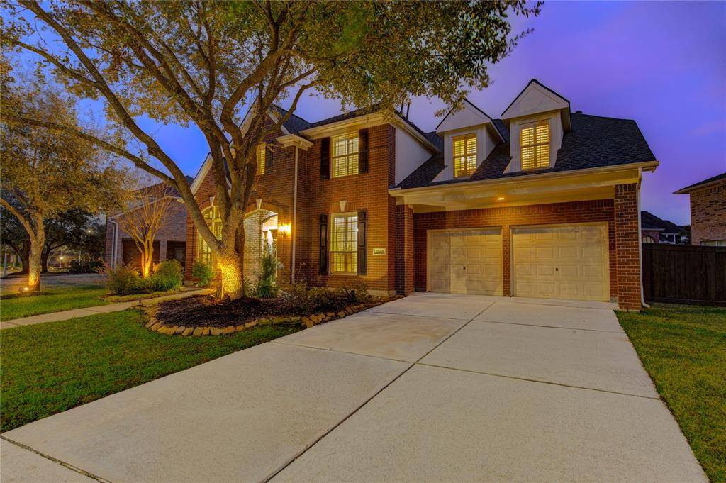 This home boasts a classic and timeless brick exterior, enhanced by fresh landscaping and a welcoming covered entry. The double-wide driveway leads to a spacious three-car garage, providing ample parking and convenience.