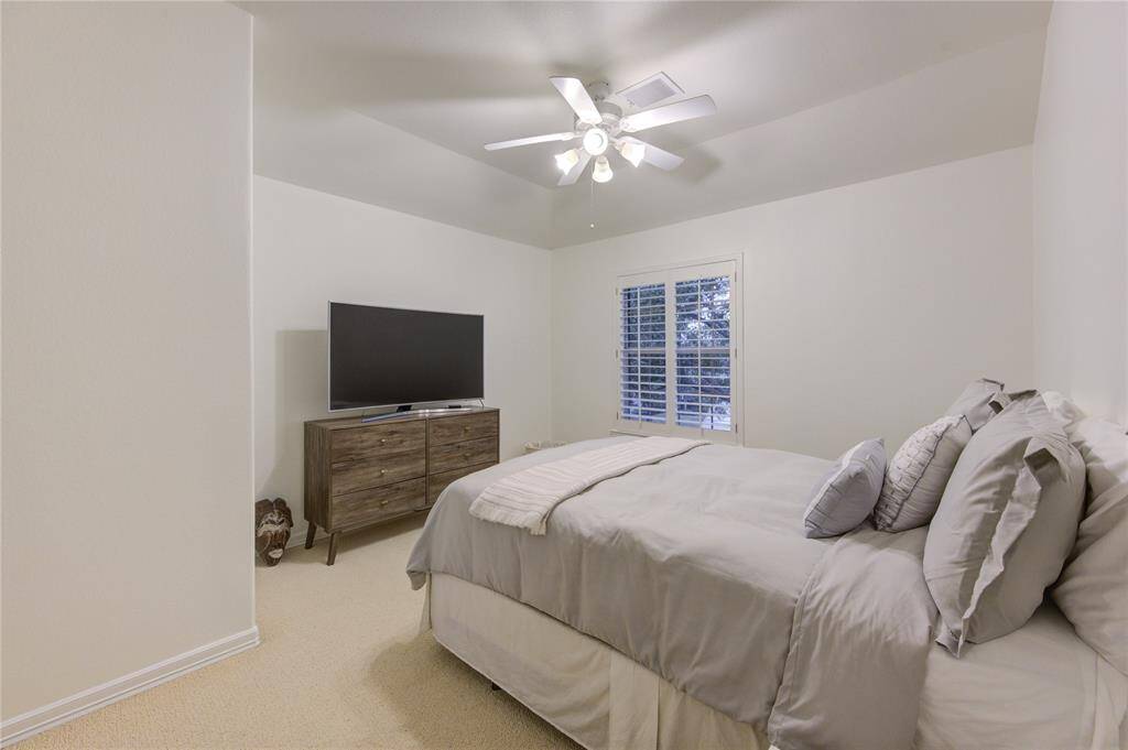 Each secondary bedroom is generously sized, featuring fresh paint, ceiling fans, and ample closet space.